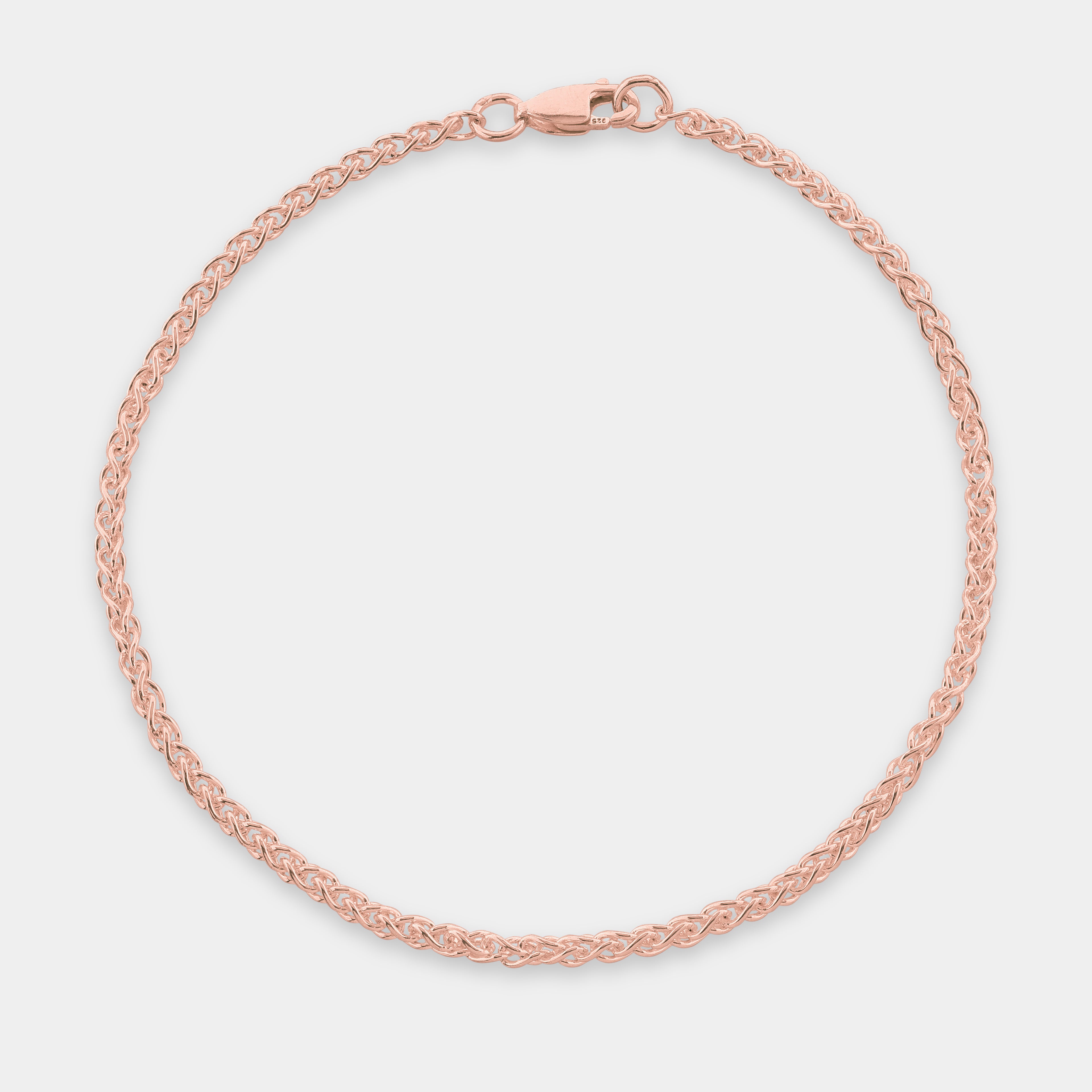 Rose gold Monarch Spiga bracelet on a light gray background