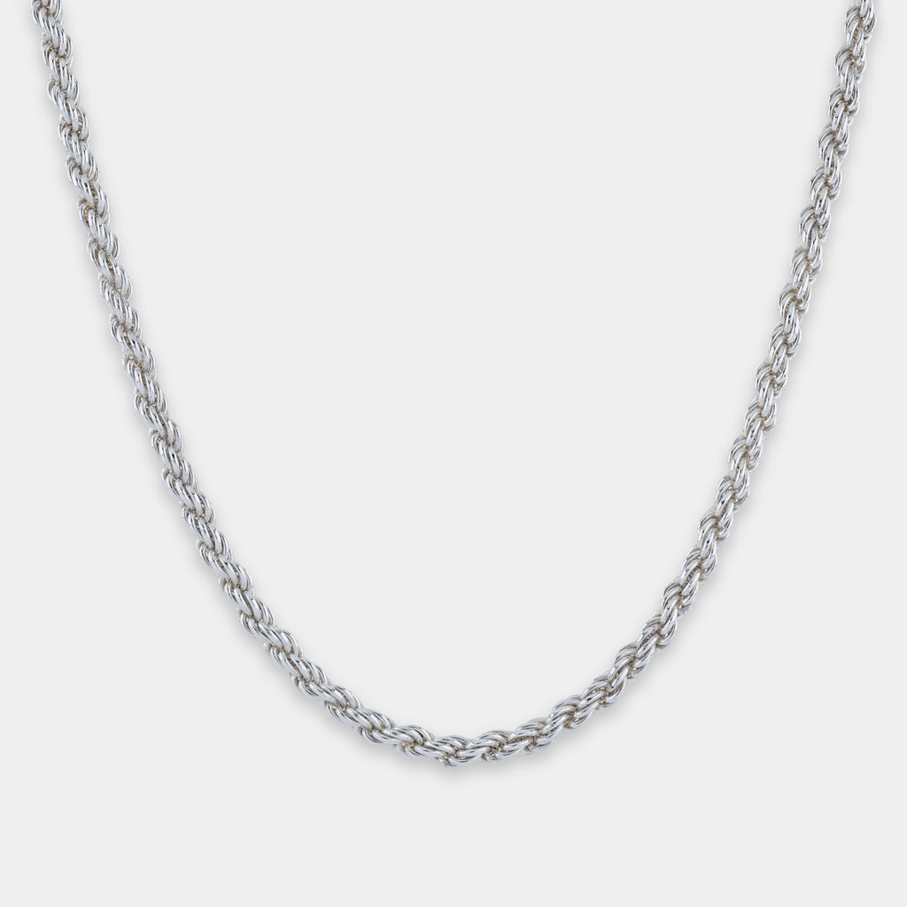 Silver chain rope necklace on a light gray background
