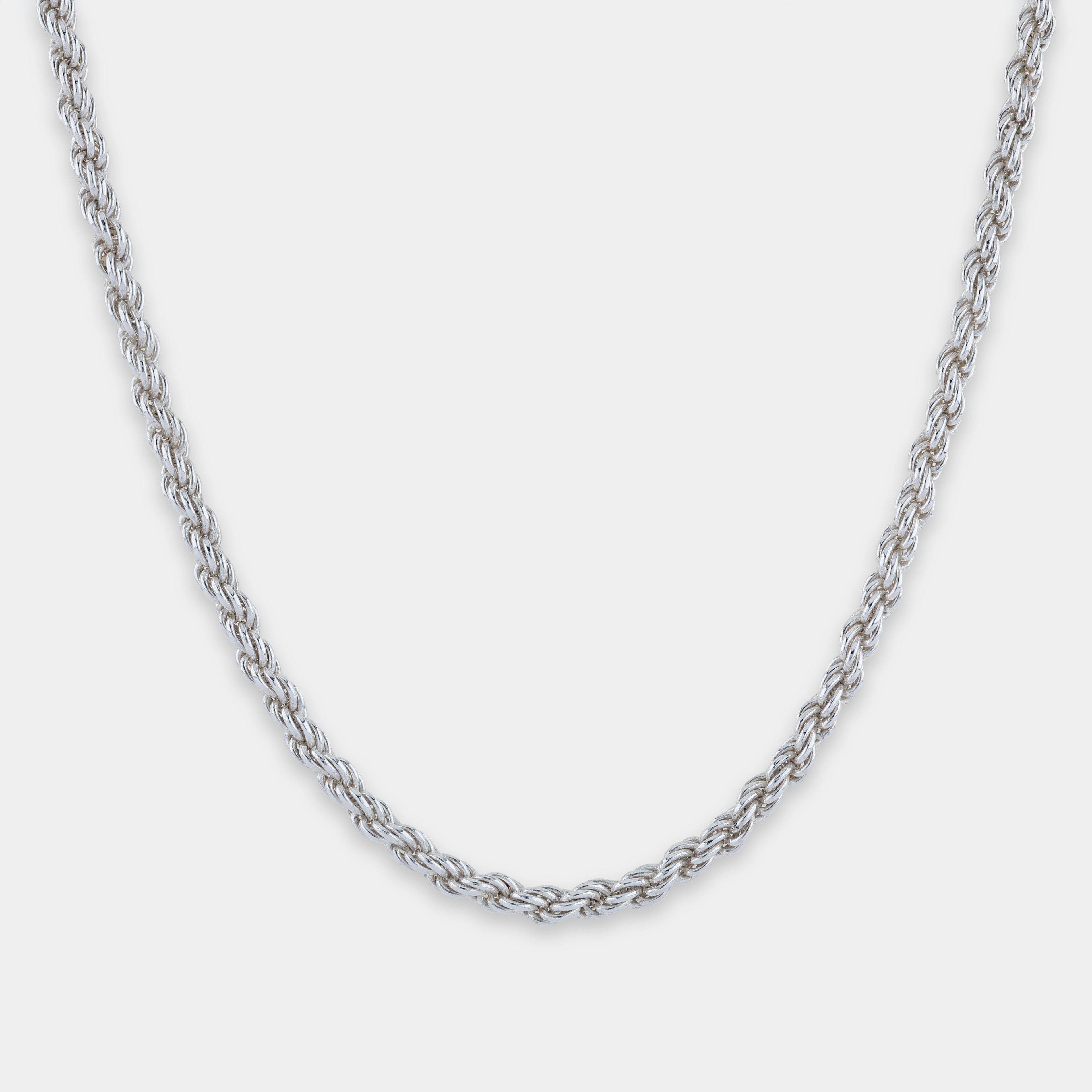 Silver chain rope necklace on a light gray background