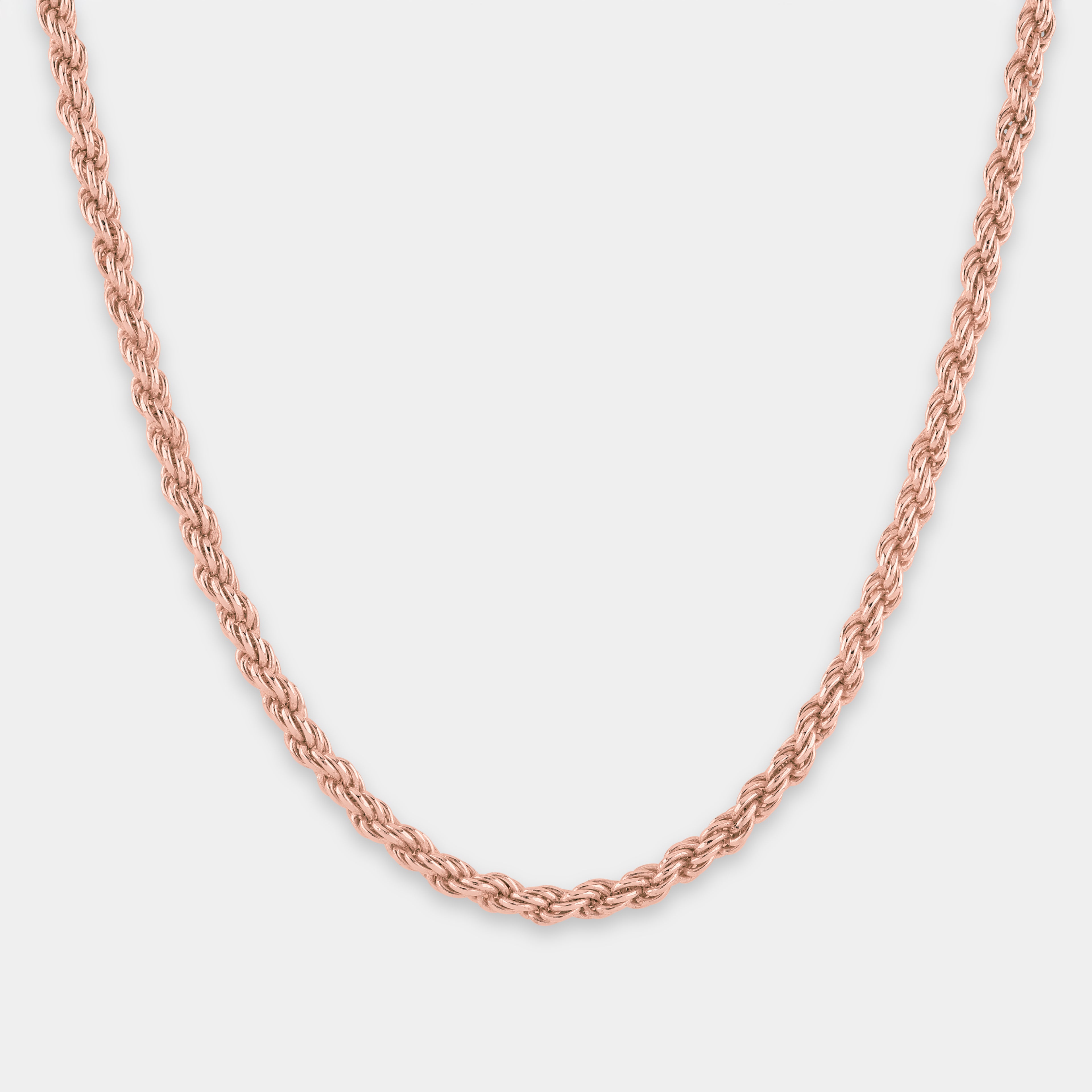 Rose gold 'rope' chain on a light gray background