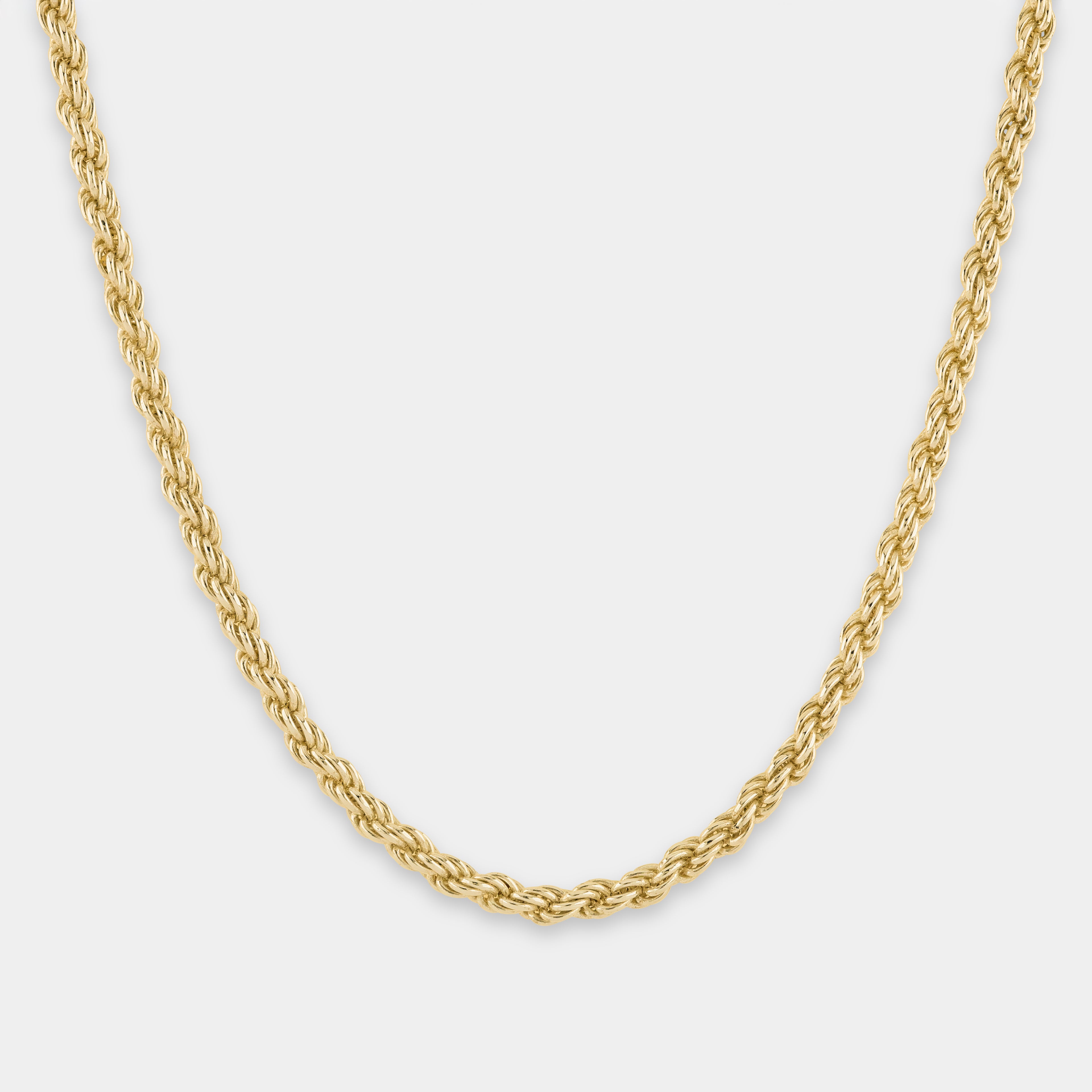Gold 'rope' chain necklace on a light gray background